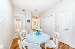 Dining room with light wood-style flooring - 