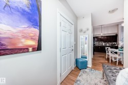 Hall featuring light wood finished floors - 