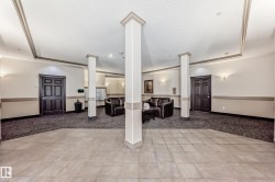 Community lobby with recessed lighting and a textured ceiling - 