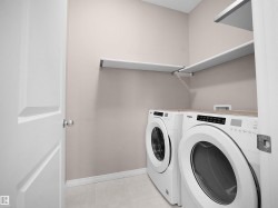 Laundry area with baseboards and washing machine and dryer - 