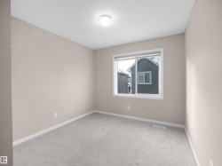 Empty room with carpet and a textured ceiling - 