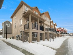 Snow covered building featuring a residential view - 