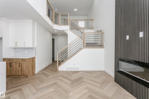Stairs with recessed lighting and a high ceiling - 220 Edgemont Green Green, Edmonton, AB - Indoor Photo Showing Other Room