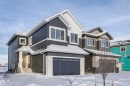 View of front of home with an attached garage - 220 Edgemont Green Green, Edmonton, AB  - Outdoor With Facade 