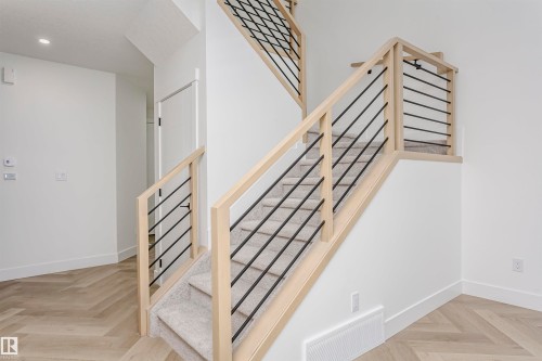 Staircase with baseboards and recessed lighting - 220 Edgemont Green Green, Edmonton, AB - Indoor Photo Showing Other Room