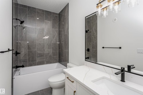 Bathroom featuring shower / bath combination, vanity, and a textured ceiling - 220 Edgemont Green Green, Edmonton, AB - Indoor Photo Showing Bathroom