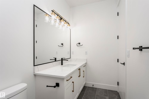Bathroom featuring vanity and toilet - 220 Edgemont Green Green, Edmonton, AB - Indoor Photo Showing Bathroom