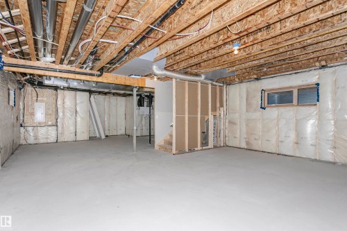 Unfinished below grade area featuring stairway and electric panel - 220 Edgemont Green Green, Edmonton, AB - Indoor Photo Showing Basement
