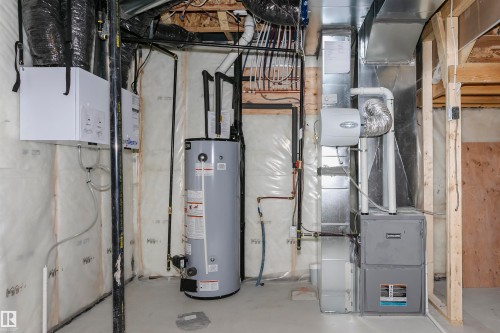 Utilities with water heater and heating unit - 220 Edgemont Green Green, Edmonton, AB - Indoor Photo Showing Basement