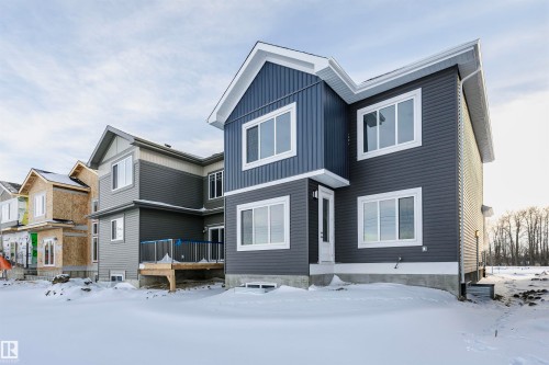 Snow covered back of property featuring a deck - 220 Edgemont Green Green, Edmonton, AB - Outdoor With Facade