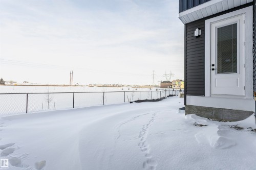 View of yard layered in snow - 220 Edgemont Green Green, Edmonton, AB - Outdoor