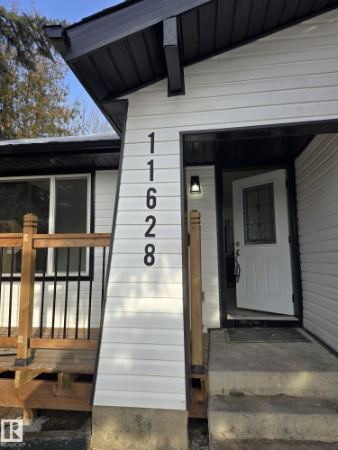 Property entrance with covered porch - 11628 151 Avenue Nw, Edmonton, AB - Outdoor With Exterior