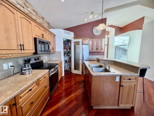 1207 Oakland Drive, Devon, AB - Indoor Photo Showing Kitchen With Double Sink