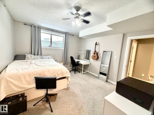 1207 Oakland Drive, Devon, AB - Indoor Photo Showing Bedroom