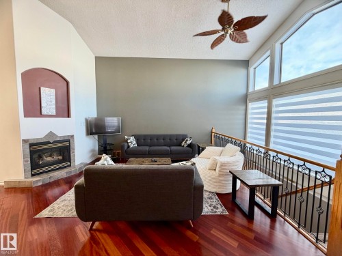1207 Oakland Drive, Devon, AB - Indoor With Fireplace