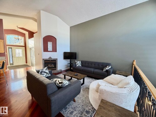 1207 Oakland Drive, Devon, AB - Indoor Photo Showing Living Room With Fireplace