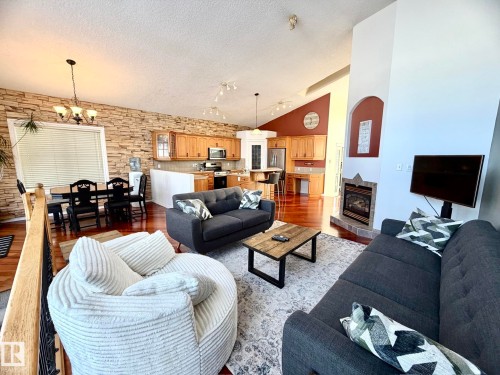 1207 Oakland Drive, Devon, AB - Indoor Photo Showing Living Room With Fireplace