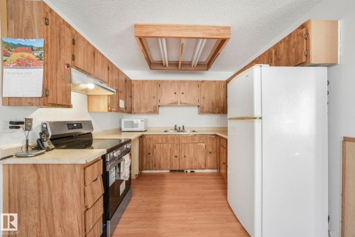 9142 180A Avenue, Edmonton, AB - Indoor Photo Showing Kitchen With Double Sink