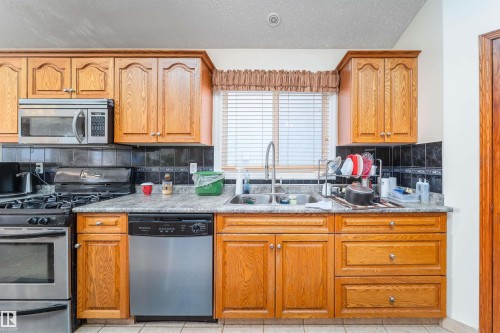 6928 164 Avenue, Edmonton, AB - Indoor Photo Showing Kitchen With Double Sink