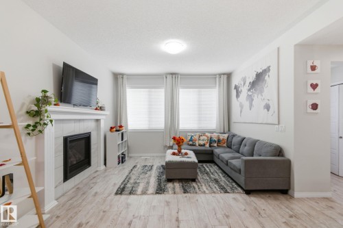 1511 Secord Rd, Edmonton, AB - Indoor Photo Showing Living Room With Fireplace