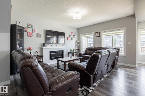 9327 Cooper Bend Bend, Edmonton, AB - Indoor Photo Showing Living Room With Fireplace