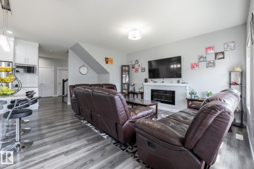 9327 Cooper Bend, Edmonton, AB - Indoor Photo Showing Other Room With Fireplace