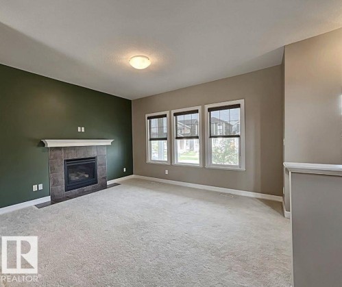 356 Southfork Drive, Leduc, AB - Indoor Photo Showing Living Room With Fireplace