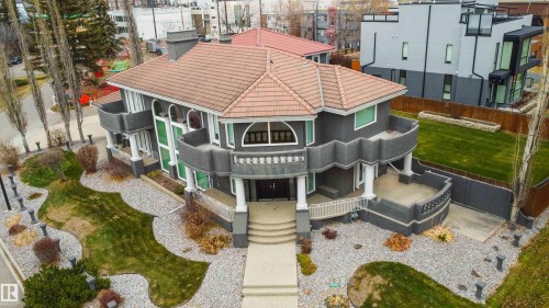 View of front facade featuring a tile roof and stucco siding - 12428 103 Avenue, Edmonton, AB - Outdoor With Facade