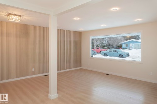 Unfurnished room with light wood-type flooring and baseboards - 13711 133 Avenue, Edmonton, AB - Indoor Photo Showing Other Room