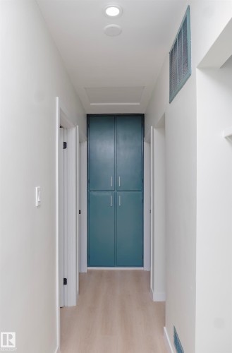Corridor featuring light wood-style flooring and attic access - 13711 133 Avenue, Edmonton, AB - Indoor Photo Showing Other Room