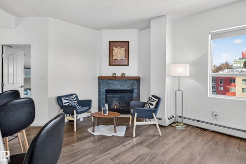 704 9707 105 Street, Edmonton, AB - Indoor With Fireplace