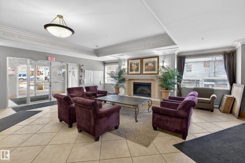704 9707 105 Street, Edmonton, AB - Indoor With Fireplace