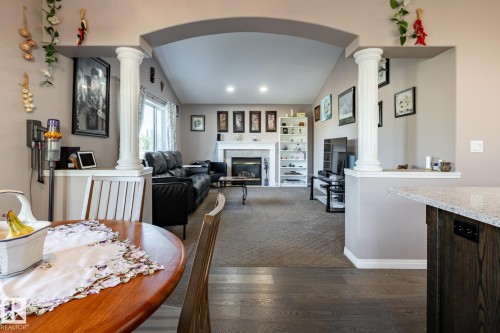 40 Deer Park Boulevard, Spruce Grove, AB - Indoor Photo Showing Dining Room With Fireplace