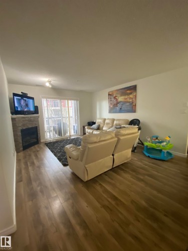 319 17415 99 Avenue Nw, Edmonton, AB - Indoor Photo Showing Living Room With Fireplace