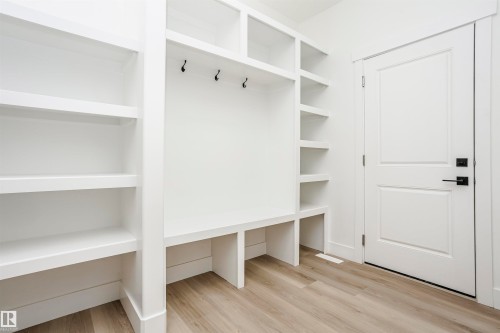 Mudroom featuring light wood-style floors - 804 Elderberry Crest, Edmonton, AB - Indoor With Storage