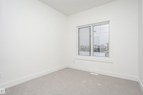 Carpeted spare room with baseboards - 804 Elderberry Crest, Edmonton, AB - Indoor Photo Showing Other Room