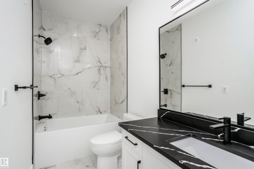 Full bathroom featuring a combined bath / shower with marble appearance, vanity, and marble look tile flooring - 804 Elderberry Crest, Edmonton, AB - Indoor Photo Showing Bathroom