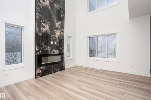 804 Elderberry Crest, Edmonton, AB - Indoor Photo Showing Other Room With Fireplace