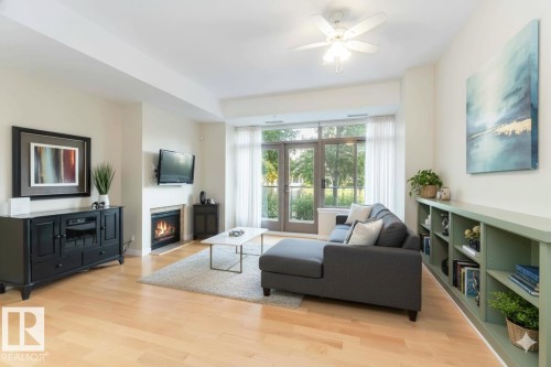 108 2504 109 Street, Edmonton, AB - Indoor Photo Showing Living Room With Fireplace