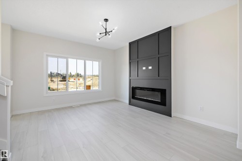 2113 Crossbill Lane, Edmonton, AB - Indoor Photo Showing Living Room With Fireplace