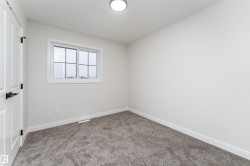 Unfurnished room featuring baseboards and carpet flooring - 