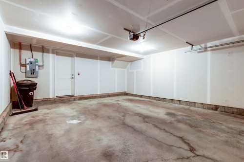 Garage featuring electric panel and a garage door opener - 36 330 Bulyea Road, Edmonton, AB - Indoor Photo Showing Garage