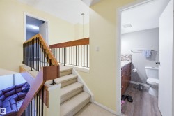 Staircase with baseboards and wood finished floors - 