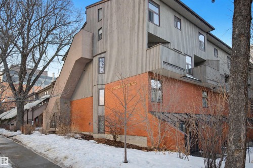Snow covered building featuring a view of apartment building / complex - 11108 83 Avenue Nw, Edmonton, AB - Outdoor With Exterior
