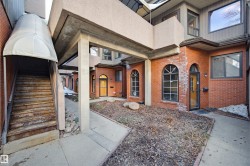 Property entrance with brick siding - 