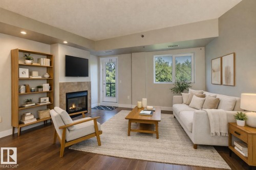 205 9316 82 Avenue, Edmonton, AB - Indoor Photo Showing Living Room With Fireplace