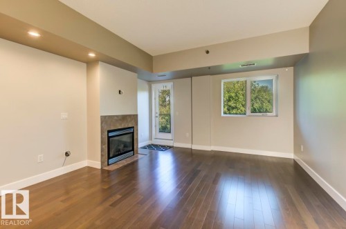 205 9316 82 Avenue, Edmonton, AB - Indoor Photo Showing Other Room With Fireplace