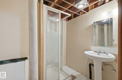 Full bathroom featuring a stall shower - 11515 101 Street, Edmonton, AB - Indoor Photo Showing Bathroom