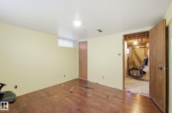Unfurnished bedroom featuring hardwood / wood-style floors - 