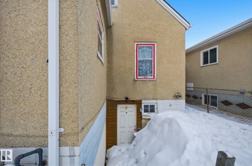 View of side of home with stucco siding - 11515 101 Street, Edmonton, AB - Outdoor With Exterior